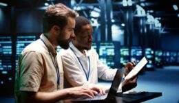 Coworkers running data center tests