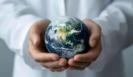Hands Holding Earth Representing Care and Protection of the Planet
