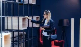 Interior designer checking design elements in home design showroom