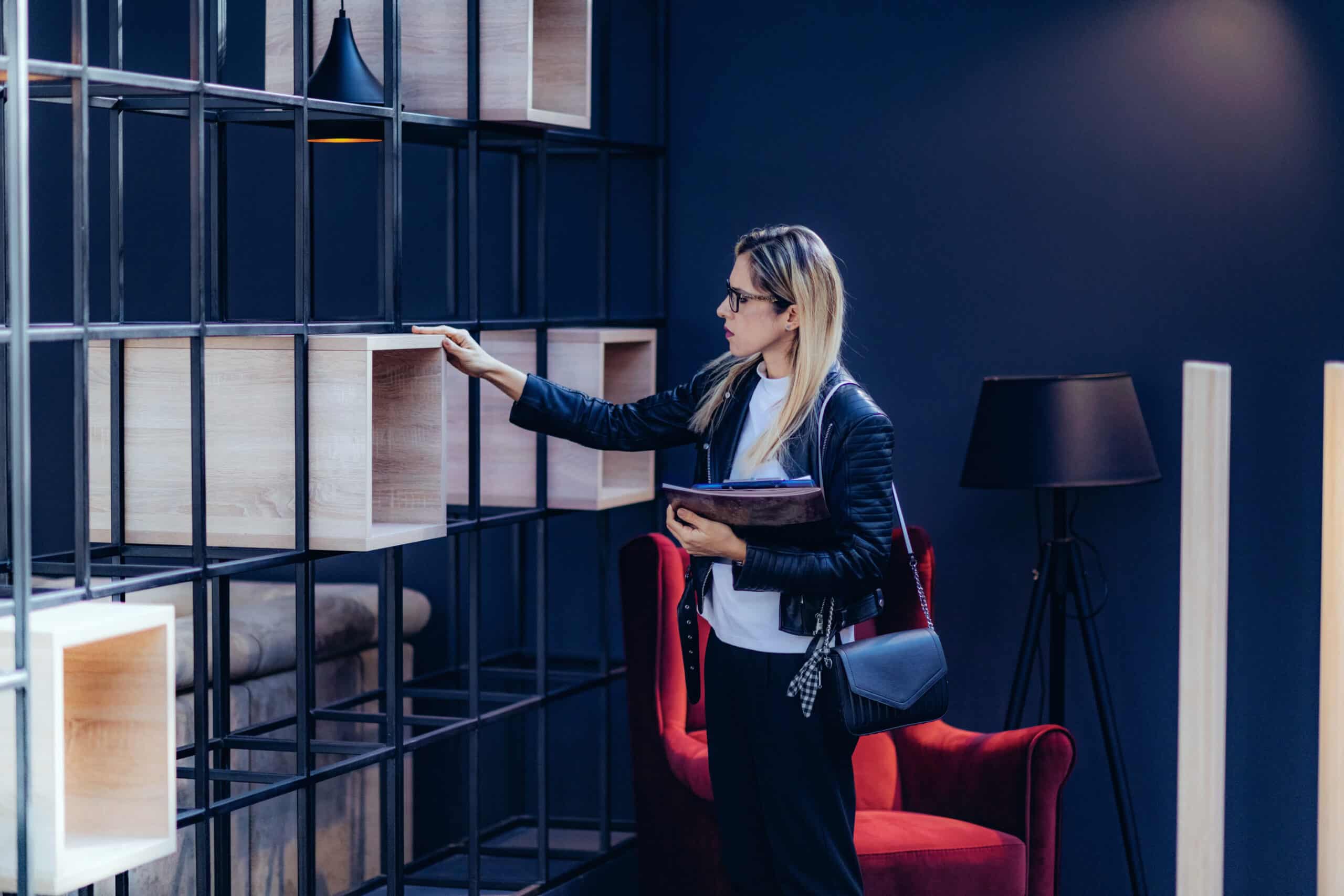 Interior designer checking design elements in home design showroom