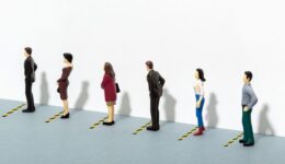 Coronavirus COVID-19 virus social distancing concept. Stay six feet or two meters apart. People waiting their turn in a row. Copy space