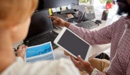 business team with laptop, chart and tablet pc