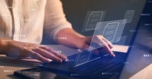 Businesswoman working on laptop with virtual screen. Process automation to efficiently manage files. Online documentation database and document management system concept.