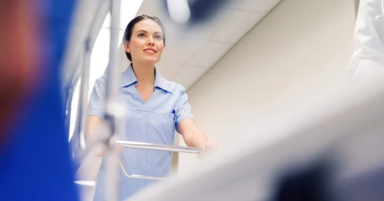 medic carrying hospital gurney at emergency