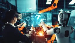 Mechanized industry robot and human worker working together in future factory